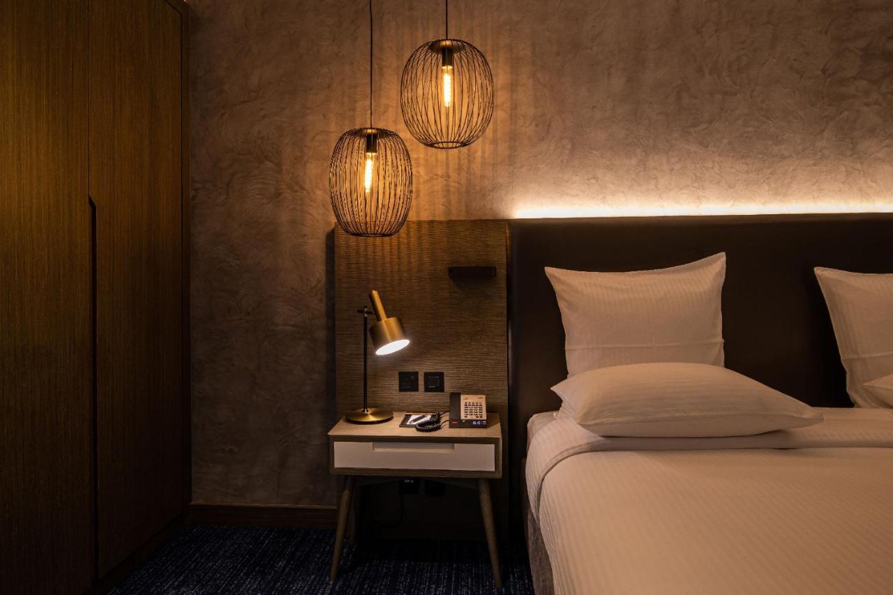 Hotel Pullman Schardscha Exterior foto A room at the hotel