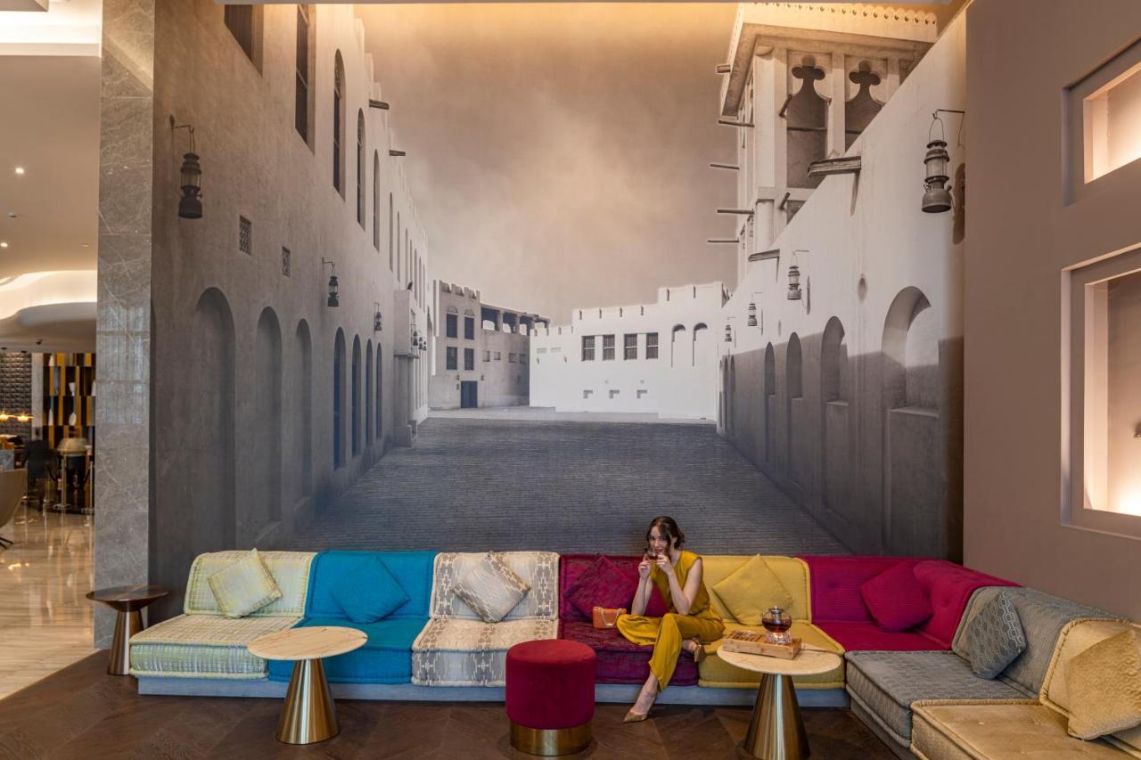 Hotel Pullman Schardscha Exterior foto The lobby of the hotel